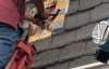 Roofsimple working on roof installing new roofing system for Suzanne