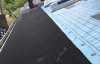 Roofsimple working on roof installing new roofing system for John McClain