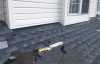 Roofsimple working on roof installing new roofing system for George Caylor
