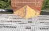 Roofsimple working on roof installing new roofing system for Allen Burton