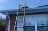 Roofsimple working on roof installing new roofing system for Tim Anderson