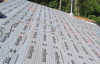 Roofsimple working on roof installing new roofing system for Ray M