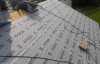 Roofsimple working on roof installing new roofing system for Ryan Wilharm