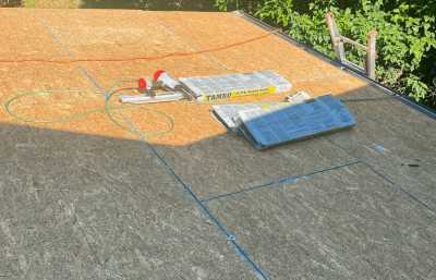 Roofsimple working on roof installing new roofing system for Marc Houde