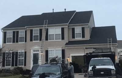 Roofsimple installing new roofing system for Andrew Lee