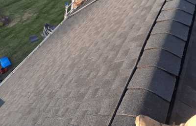 Roofsimple working on roof installing new roofing system for Jose Torres