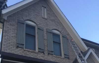 Roofsimple working on roof installing new roofing system for Trina