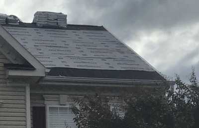 Roofsimple working on roof installing new roofing system for Dan P