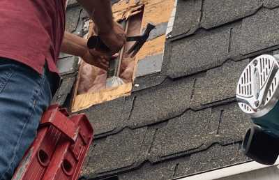 Roofsimple working on roof installing new roofing system for Suzanne
