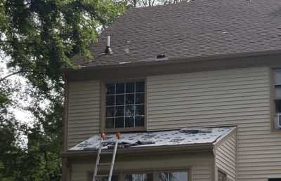 Roofsimple working on roof installing new roofing system for Ron Tokash