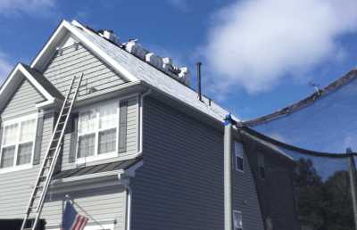 Roofsimple working on roof installing new roofing system for Jeff L