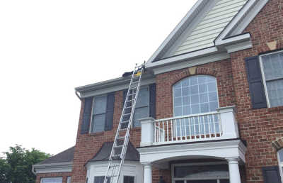 Roofsimple working on roof installing new roofing system for Lisa Salazar