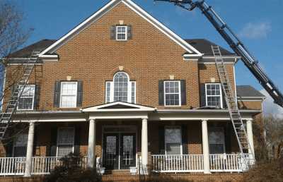 Roofsimple working on roof installing new roofing system for James H