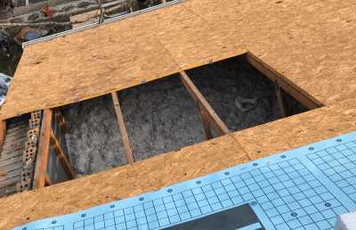 Roofsimple working on roof installing new roofing system for Tim Ivins 