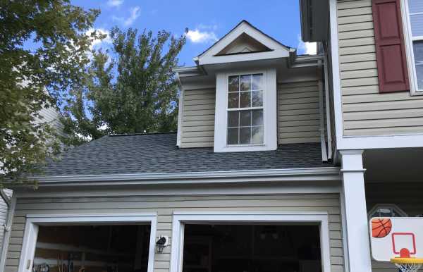 Local roofing company installing a new roof system