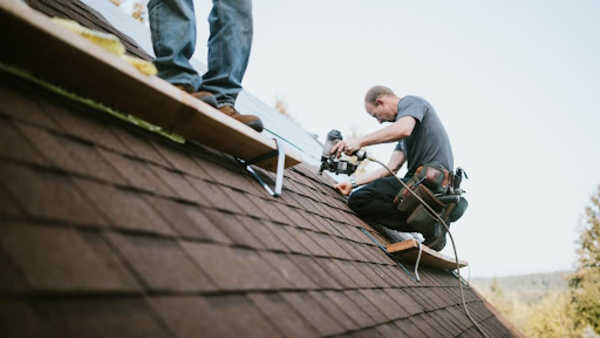 Roofing contractors installing a new roof