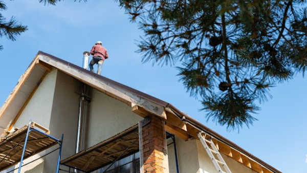 Roofing contractor installing a new roof