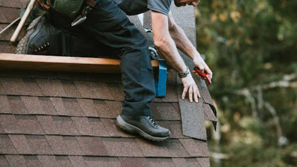 roofer installing new roof panels
