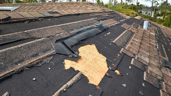broken roof tiles and shingles in need of replacement