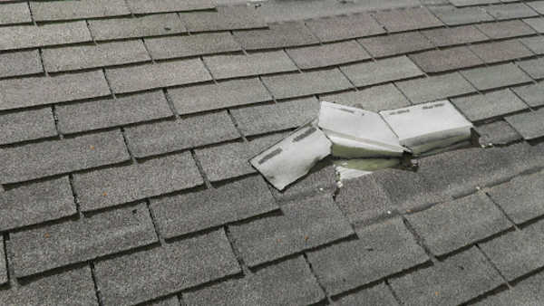 Broken roof shingles that need roof repair