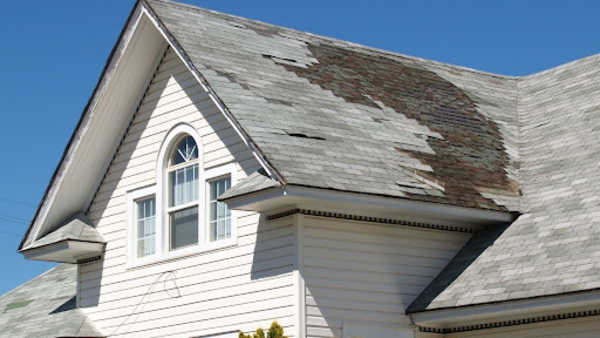 Roof with broken shingles