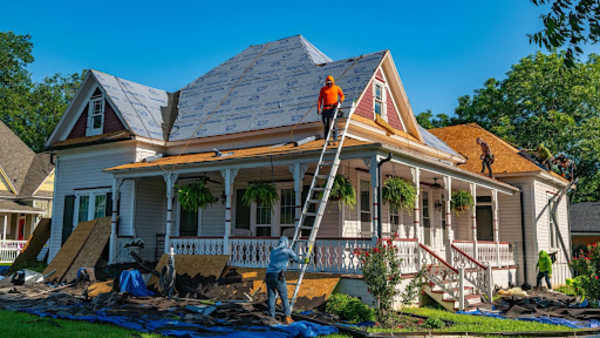 Roof shingles with leaves on them