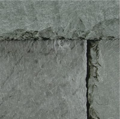 Close up of a slate tiles to show the grain, color variation and texture of slate.