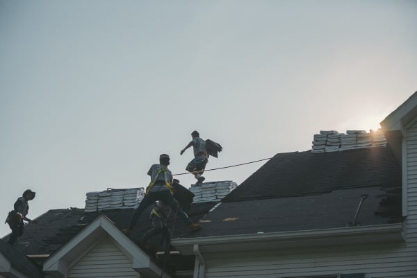 Roofers installing a new roof system