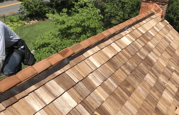 Cedar roof installation by Roofsimple with copper flashing around the chimney