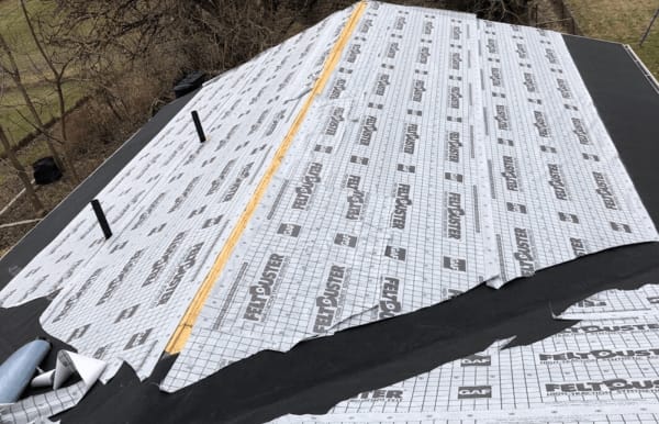 Roofsimple working on installing a new roofing system for Robert Baldwin