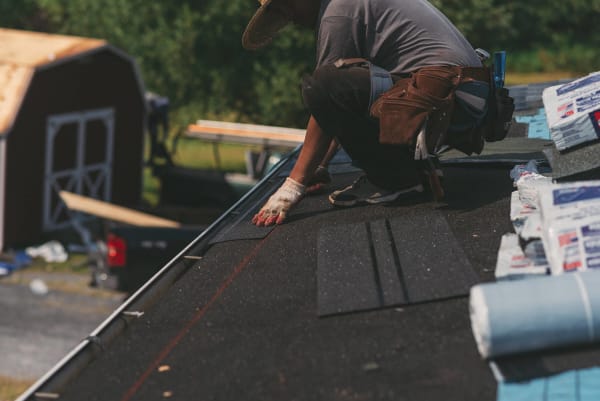 Roofing contractors replacing a roof