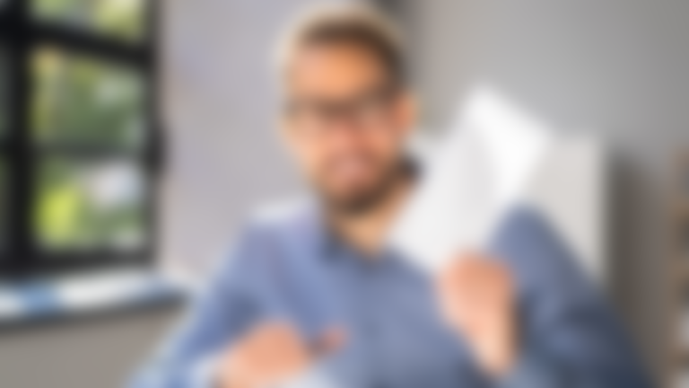 Payroll check being held by man