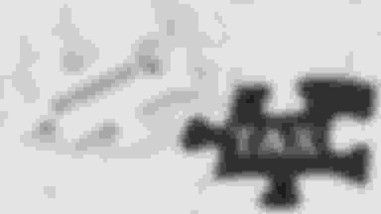 puzzle pieces labeled business and tax
