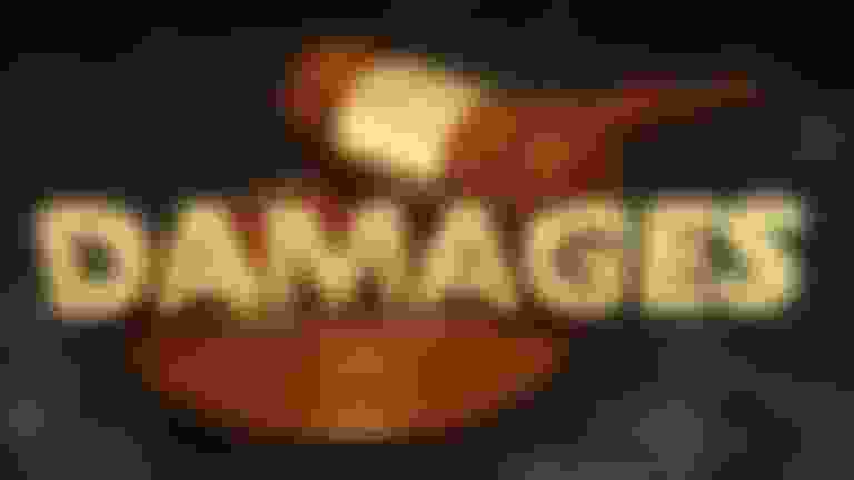 A gavel and the word "DAMAGES" written in 3D.