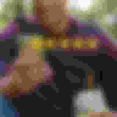 Man looking at his cell phone smiling with a 5 star graphic positioned in front