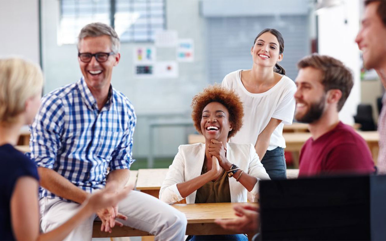 Business professionals talking and laughing.