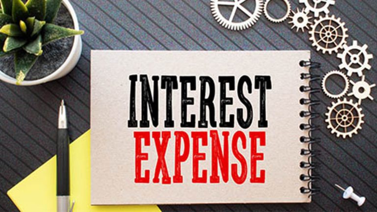 Pen, plants, sticky note, cogs and a notebook.