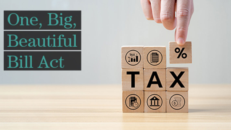 A hand stacking wooden blocks.