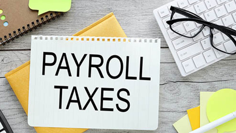 A sheet of paper, keyboard, glasses, notebook, pen and sticky notes on a desk.