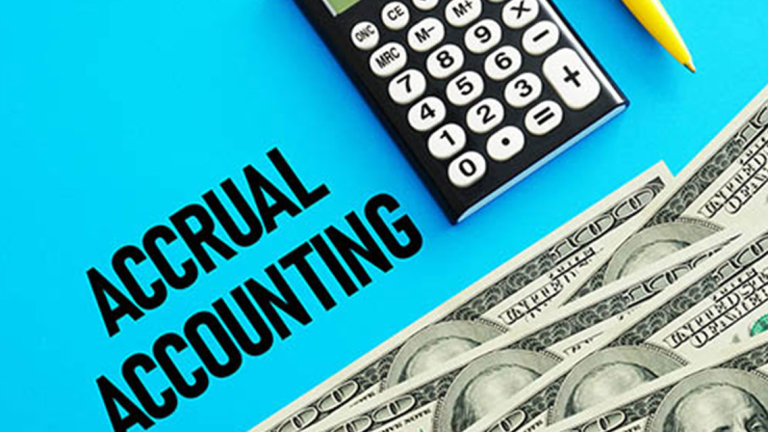 Calculator, pencil and several 100 dollar bills.