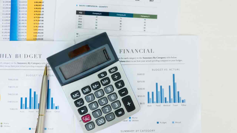 calculator on top of financial docs