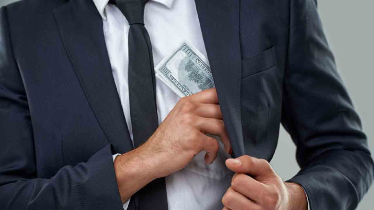man in suit with $$