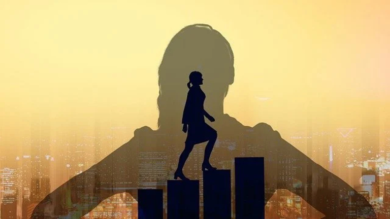 Female Professional climbing blocks.