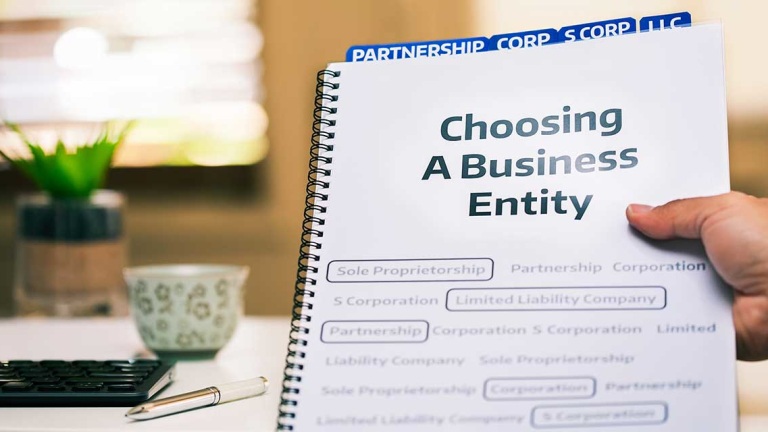 Spiral book that says Choosing A Business Entity