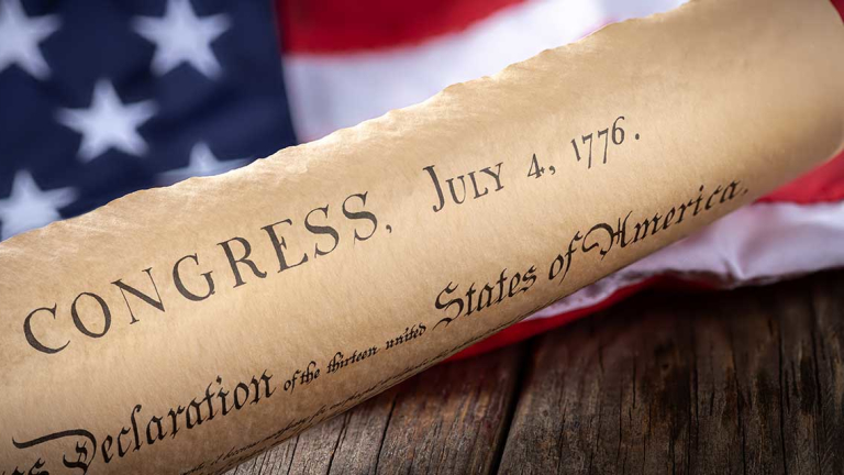 The US Constitution and American flag.