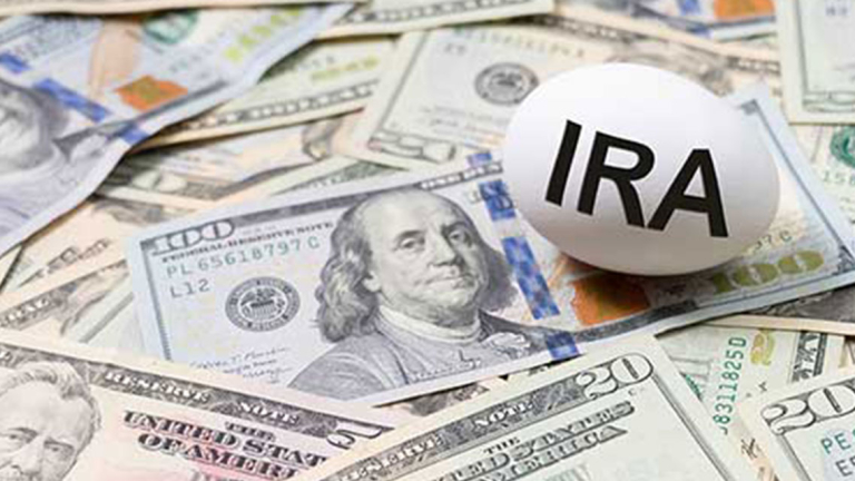 U.S. dollar bills and an egg with IRA on it.