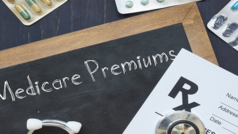 A chalkboard, RX script, pills and stethoscope.