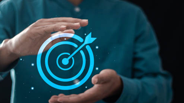 A person with a visual of a target and an arrow in the middle between their hands.