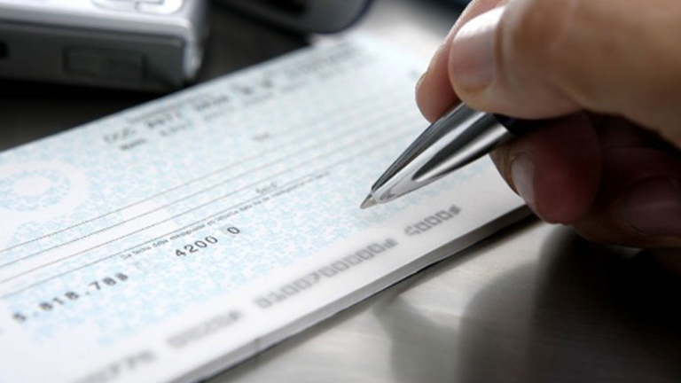 A person writing a check.