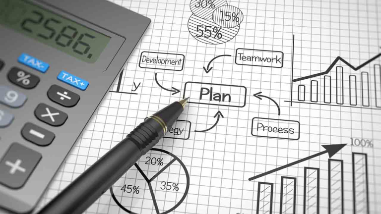 pen on desk with graphics